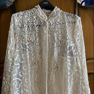 Vintage embroidered jacket with pearl trim.